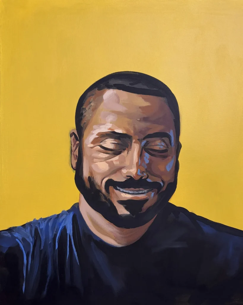 Hamza Abu Qenas, Martyrs & Heroes, Portrait by Caleb Wassell and Abid Shalabi: a smiling bearded Palestinian man with eyes closed against a yellow background.