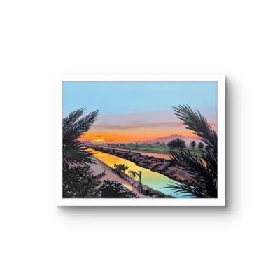 Secondaries fine art print by Caleb Wassell: sunset over a river, framed by dark palm fronds, shown framed.